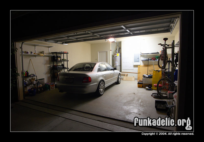 original unadjusted image. note blown out highlights (the garage lights) & lack of shadow detail (rear of car)