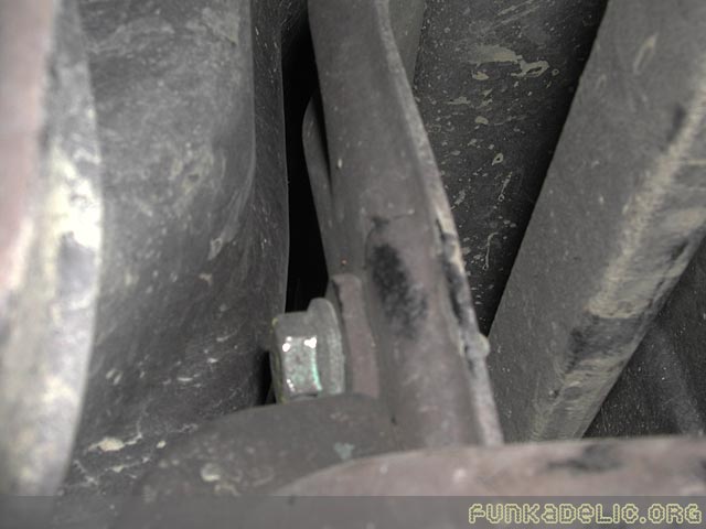 The passenger side bushing clamp's upper bolt is hard to get to. Use a thin open-ended wrench to get in there.