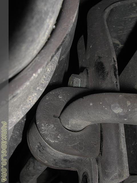 Another view of the passenger side bushing clamp's upper bolt. Not alot of clearance to get a wrench in there.