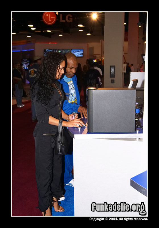 Mike Tyson and ladyfriend checking out CES