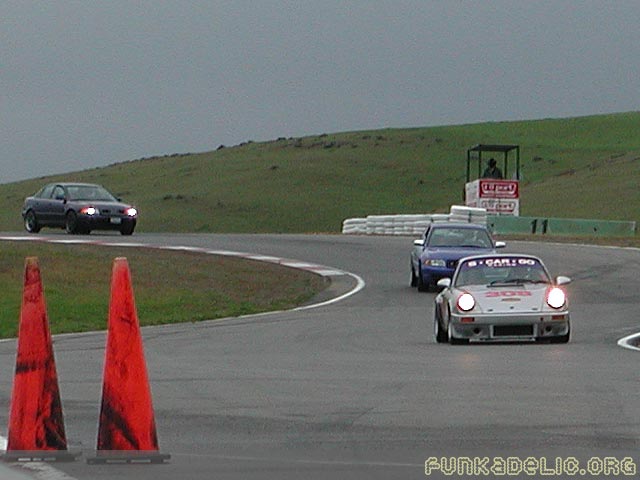 ryan and taner behind the porsche