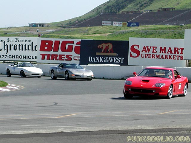 Ferrari Maranello in front of some vettes